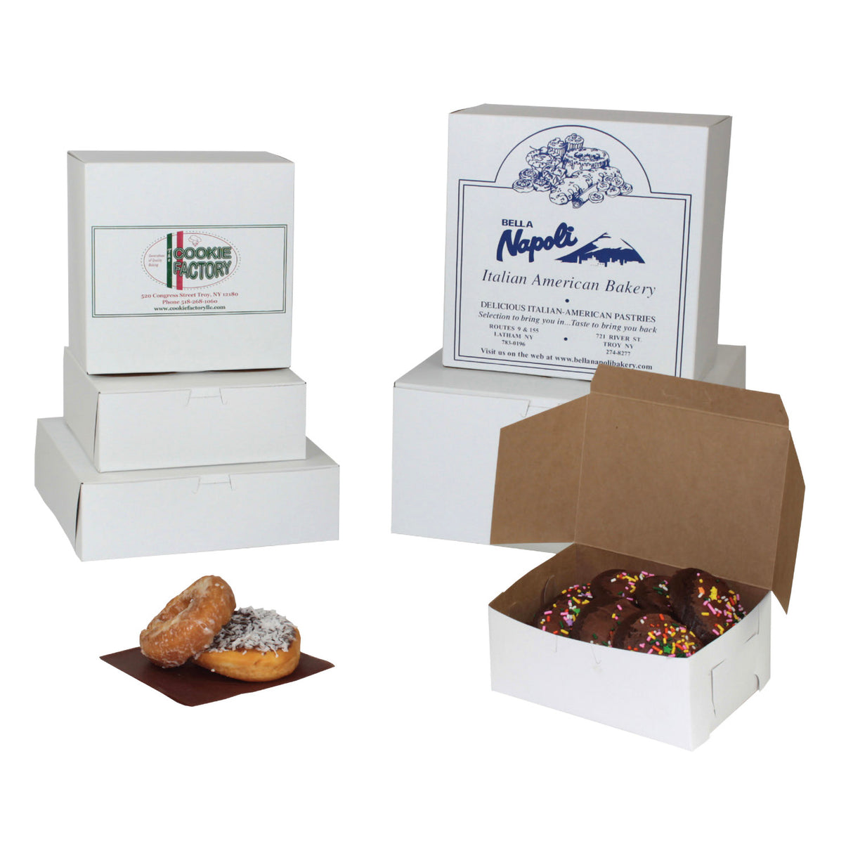 White bakery boxes shown on a white background, including closed boxes with printed labels and an open box containing chocolate donuts. Two glazed donuts and a powdered donut sit in front of the boxes.
