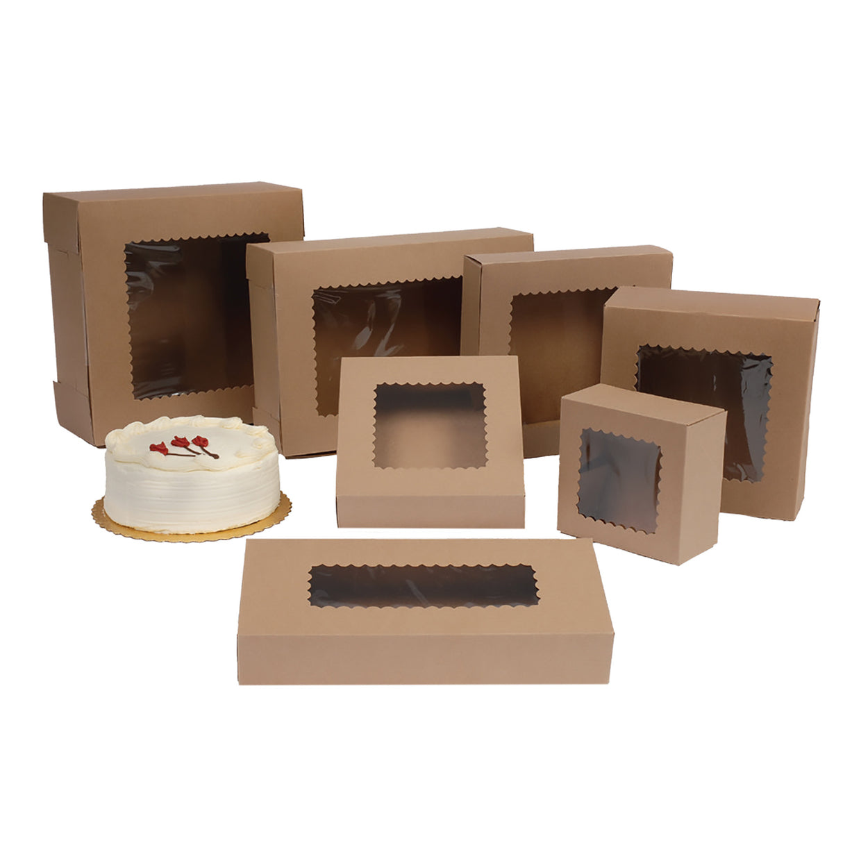 Brown Kraft bakery boxes with clear plastic window cutouts in various sizes, shown on a white background with a small white frosted cake beside one box.